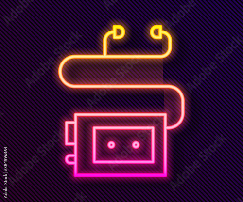 Glowing neon line Museum audio guide icon isolated on black background. Headphones for excursions. Vector.