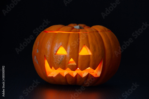 scary Halloween pumpkin in a black background