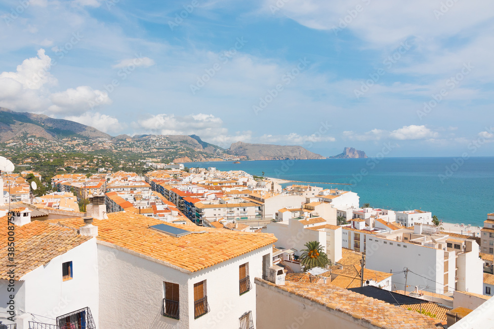 Beautiful panorama of Altea's cityscape and the mediterranean sea. Historical old town center with mountains in the background. Valencian community, Spain. High view landscape shot.