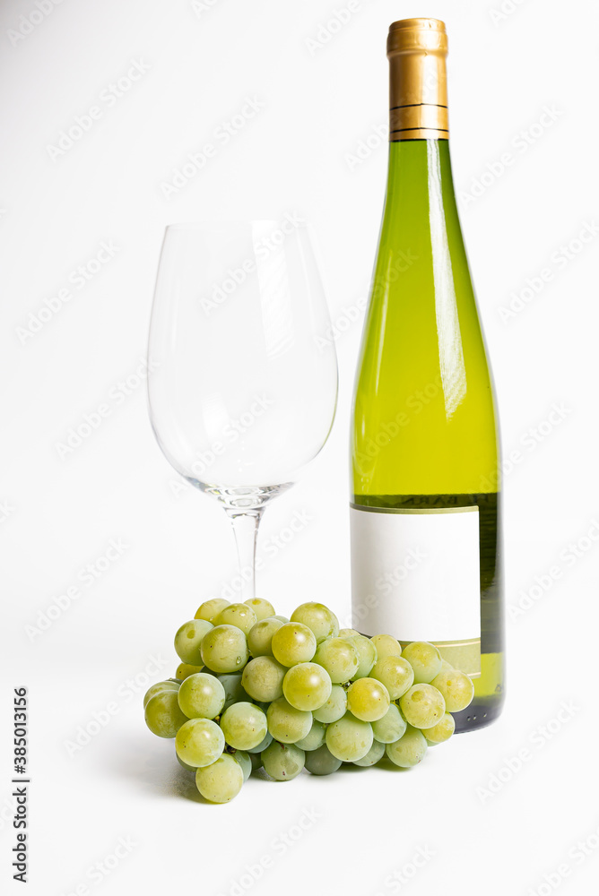 Bottle of wine, grapes and wineglass Isolated on white Bottle of wine, grapes and wineglass Isolated on white