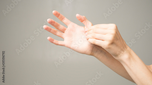 woman holds her hand - pain concept