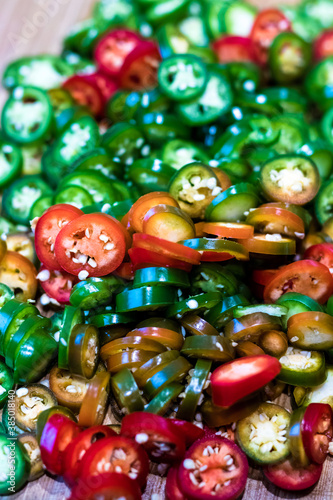Pile of colourful ripe jalapenos cuts ready for cooking and preservation.