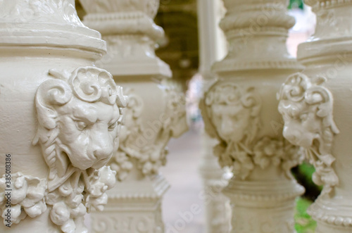 Karlovy Vary, Czechia - 2020: The pillar element of the colonnade is decorated with a small sculpture of a lion. Architectural Columns with lion...