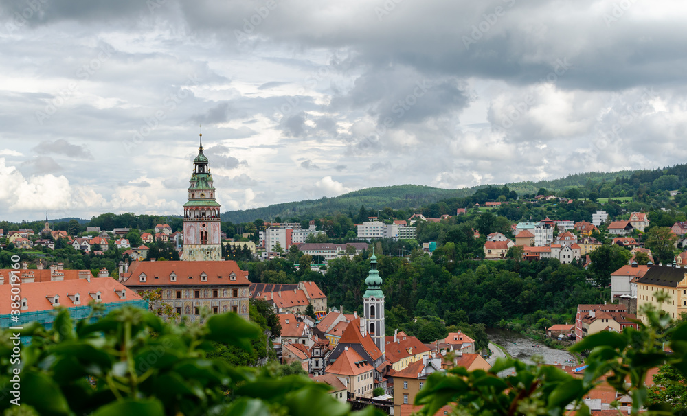 Beautiful rooftop view to historical center, church and castle in Cesky Krumlov, Czech republic.