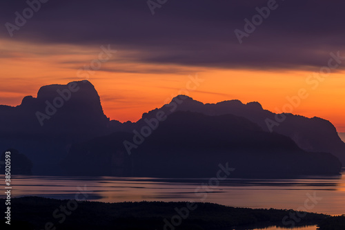 The natural background of the morning light rising in the middle of the sea and surrounded by mountains, cool breezes, the beauty of the ecology of the tourist attractions.