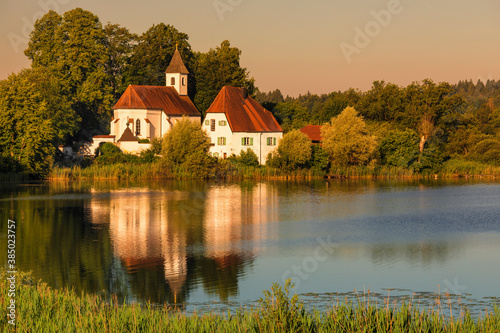 St. Walburgis Church at Seeon Abbey at Lake Seeoner See at sunrise, Chiemgau, Chiemgau Alps, Upper Bavaria photo