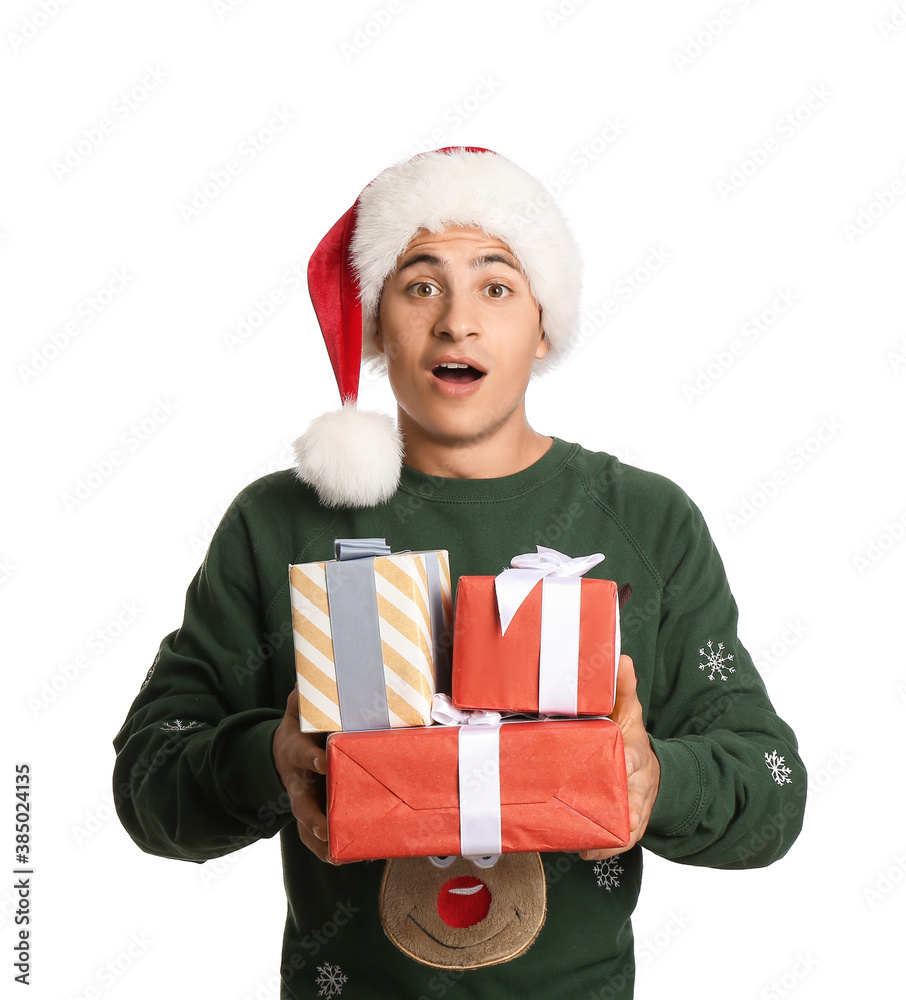 Surprised man in Santa hat and with gift boxes on white background Surprised man in Santa hat and with gift boxes on white background