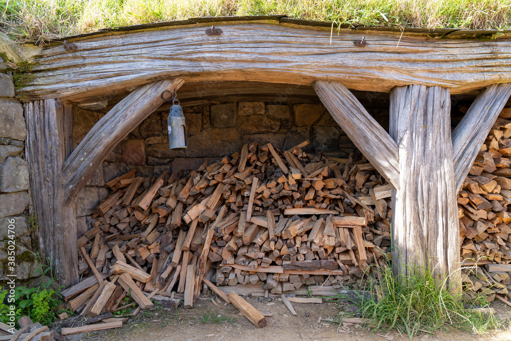 Tuinposter met stack of firewood #385024706