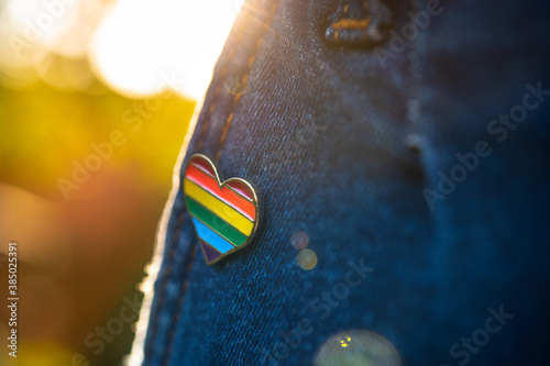 Rainbow color lgbt heart badge on jeans.