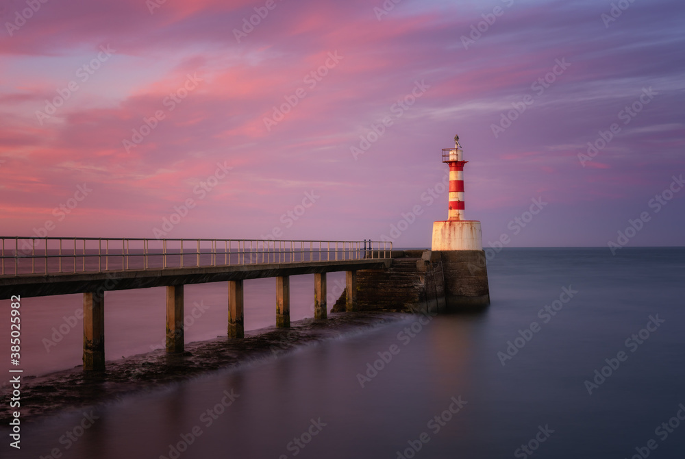 South Pier Lighthouse at sunset, Amble, Northumberland, England, United Kingdom