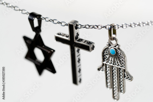 Religious symbols of Christianity, Islam and Judaism, the three monotheistic religions, Interfaith dialogue, France photo