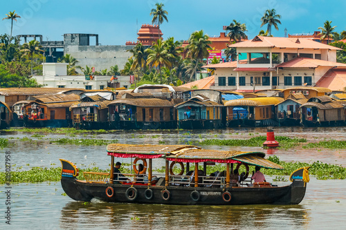 Tour boat and houseboats for the popular backwater cruises, a major tourist attraction, Alappuzha (Alleppey), Kerala, India photo