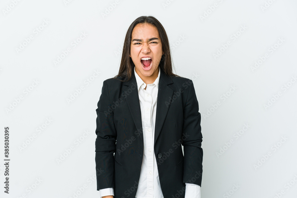 Young asian bussines woman isolated on white background screaming very angry and aggressive. Young asian bussines woman isolated on white background screaming very angry and aggressive.