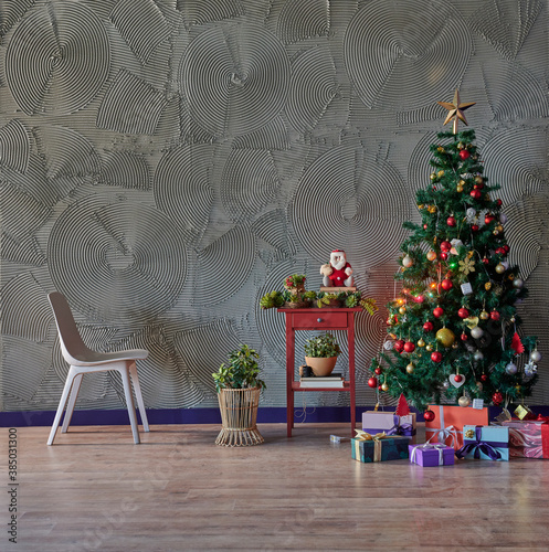 Christmas  New Year interior with grey stone wall background  decorated fir tree  chair gift and red coffee table style.