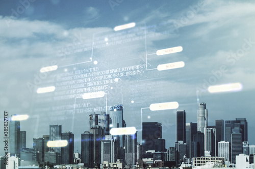Multi exposure of abstract software development hologram on Los Angeles skyscrapers background, research and analytics concept