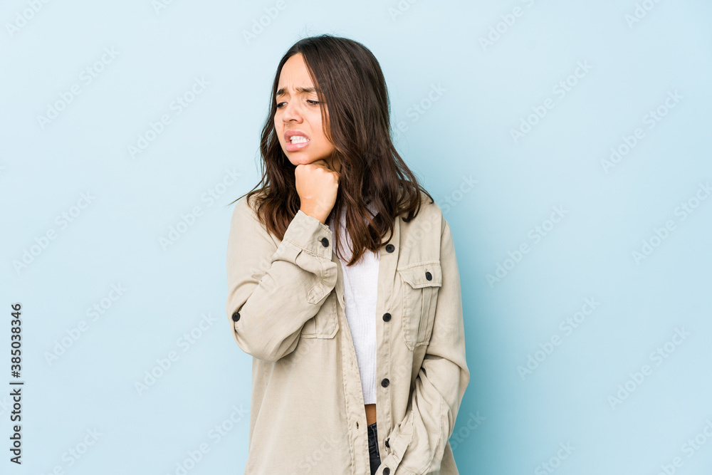 Young mixed race hispanic woman isolated suffers pain in throat due a virus or infection. Young mixed race hispanic woman isolated suffers pain in throat due a virus or infection.