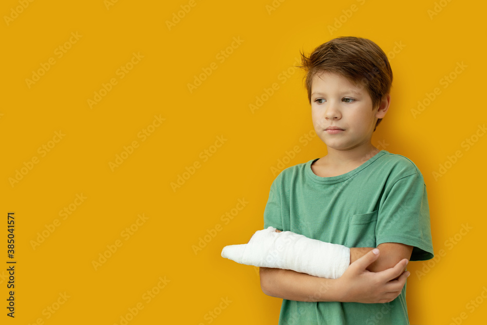 A child with a plaster on his hand. Copy space A child with a plaster on his hand. Copy space