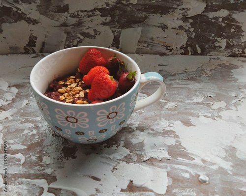 açaí in bowl with red fruits and textured background and photo captured with selective focus photo