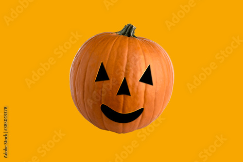 Halloween jack O 'Lantern, orange pumpkin in abstract graphics on yellow background © framarzo