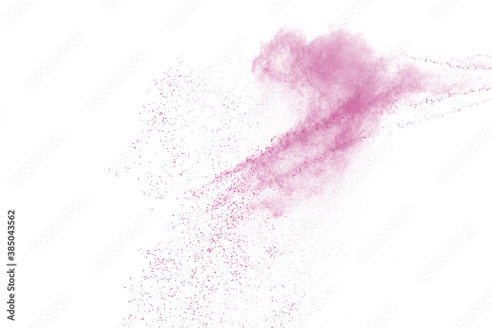 Freeze motion of pink color powder exploding on white background. 
