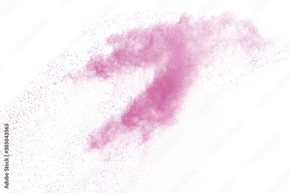Freeze motion of pink color powder exploding on white background. Freeze motion of pink color powder exploding on white background.