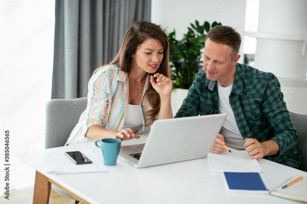 Husband and wife preparing bills to pay. Young couple having financial problems.. Husband and wife preparing bills to pay. Young couple having financial problems..