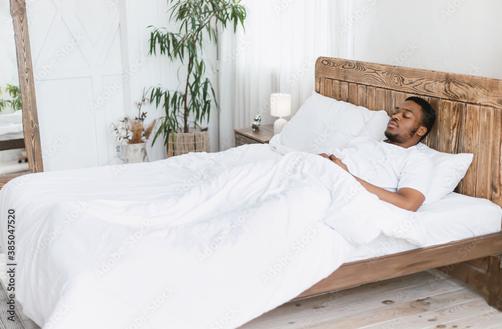 African Man Sleeping Lying With Eyes Closed In Bed Indoors Stock Photo ...