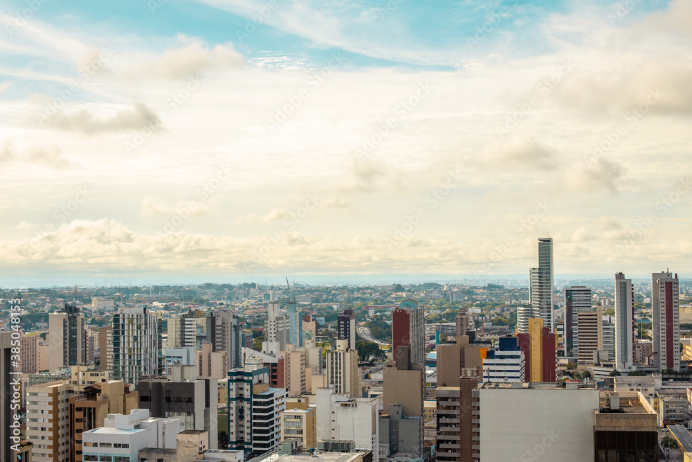 Aerial view of urbanized center with colorful skyscrapers in the morning - Curitiba, capital of Paraná state, Brazil - obrazy, fototapety, plakaty 