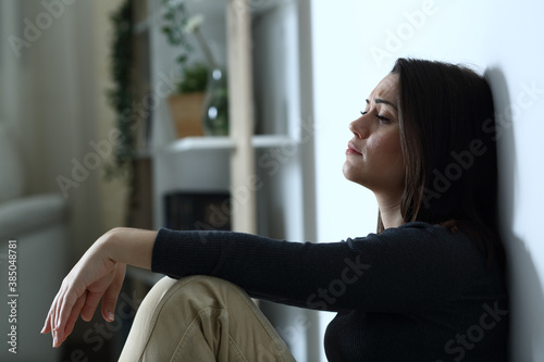 Fotografija Sad depressed woman complaining alone at night
