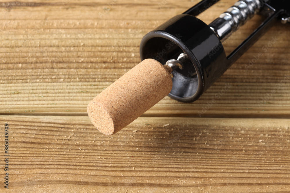 close up on a bottle opener on wooden teble with copy space for your text