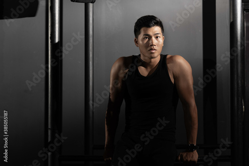 Wallpaper Mural Fitness asian man exercise training warm up body and posing in gym,Healthy lifestyle. Torontodigital.ca