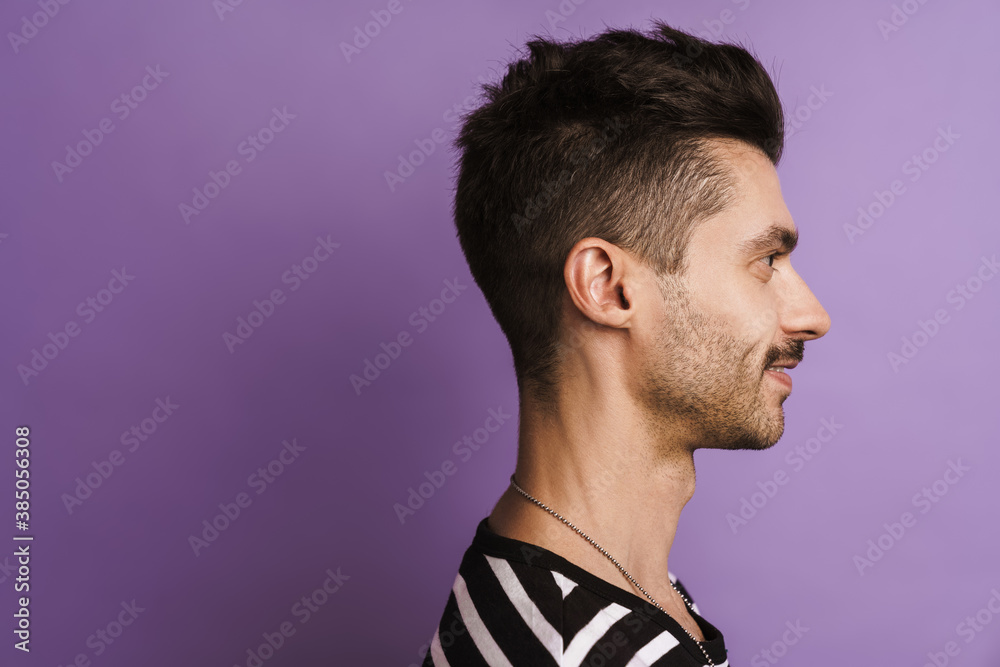 Photo in profile of happy man smiling and looking aside Photo in profile of happy man smiling and looking aside