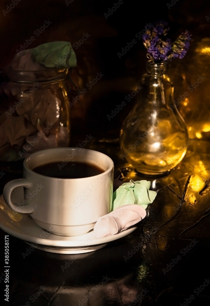Fototapeta premium Retro a cup of coffee and a few meringues on black background. Great design for any purposes.