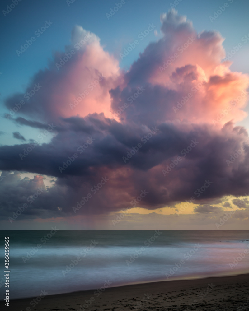 pink magenta clouds on the sea beach