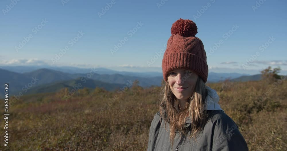 Young woman hiking in Appalachia hero shot, smiling and looking at the camera Young woman hiking in Appalachia hero shot, smiling and looking at the camera