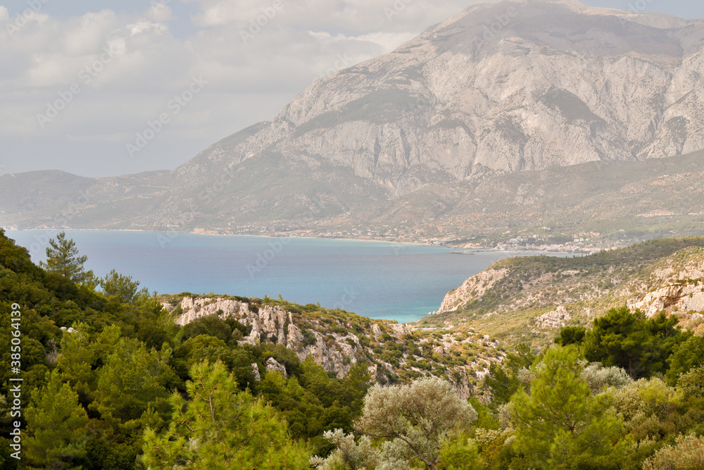 Panoramic view of the bay of Marathokampos on the Greek Aegean island of Samos with the Kerkis mountain range in the background.