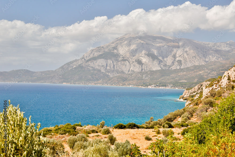 Panoramic view of the bay of Marathokampos on the Greek Aegean island of Samos with the Kerkis mountain range in the background.