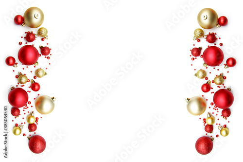 Christmas composition with gold and red festive balloons and beads on both sides  isolated on a white background. Christmas creative layout  concept with holiday decorations. Copyspace.