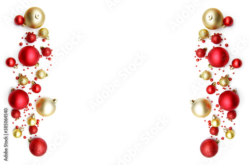 Christmas composition with gold and red festive balloons and beads on both sides, isolated on a white background. Christmas creative layout, concept with holiday decorations. Copyspace.