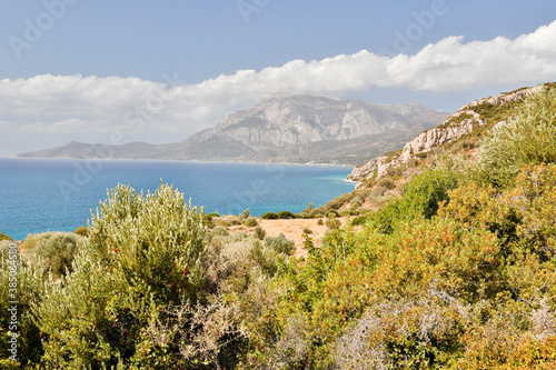 Panoramic view of the bay of Marathokampos on the Greek Aegean island of Samos with the Kerkis mountain range in the background.