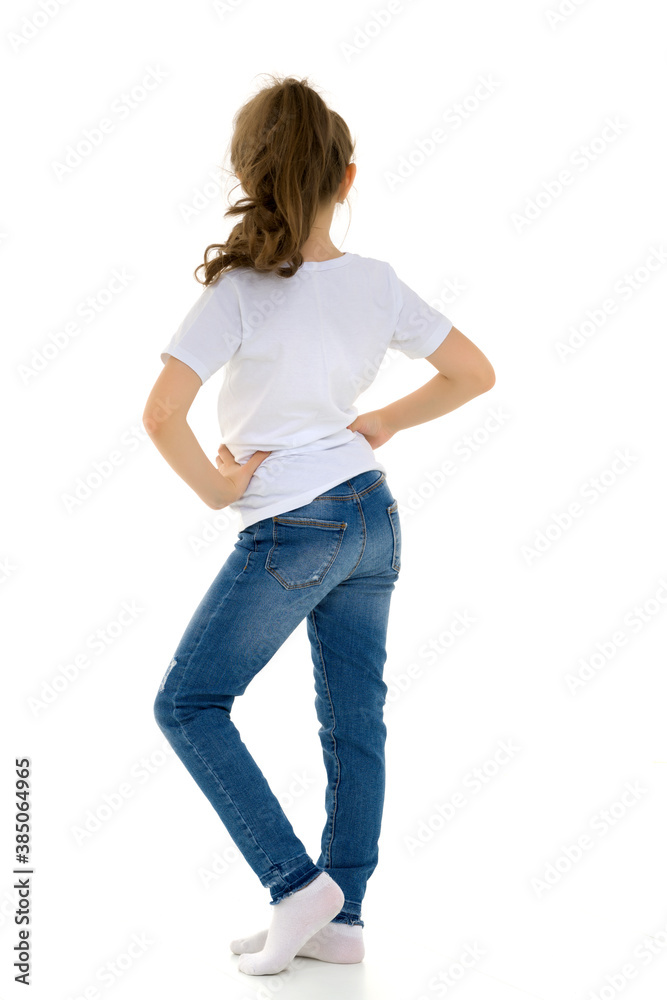 Pretty Stylish Girl with Ponytail Standing with Hands on Her Waist. Pretty Stylish Girl with Ponytail Standing with Hands on Her Waist.