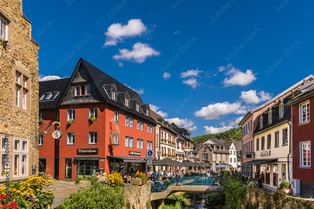 Fototapeta premium Bad Munstereifel, Germany: View of the Historical Medieval City with the typical Half-timbered Houses and Blue Sky