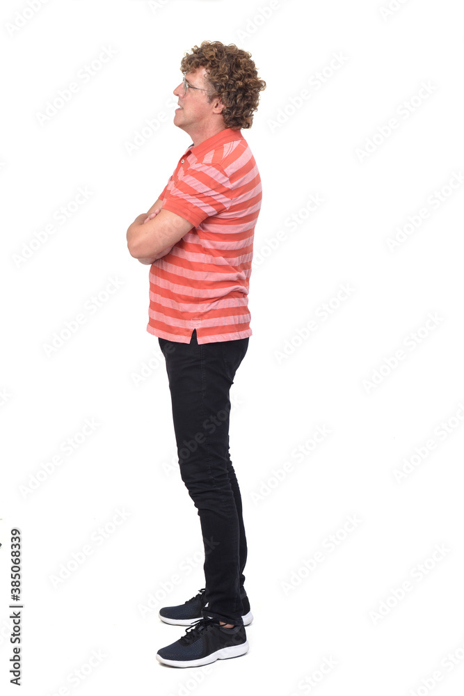 full portrait of a man, side view with curly hair and white background, arms crossed full portrait of a man, side view with curly hair and white background, arms crossed