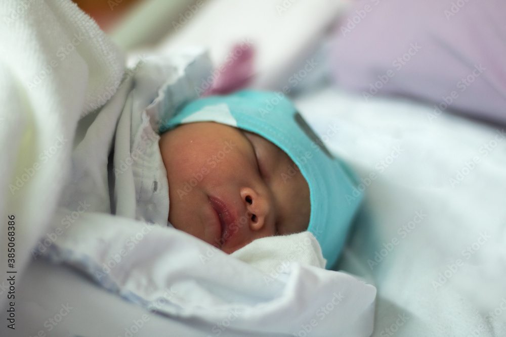 New Born Baby Girl Sleeping on Hospital Bed New Born Baby Girl Sleeping on Hospital Bed