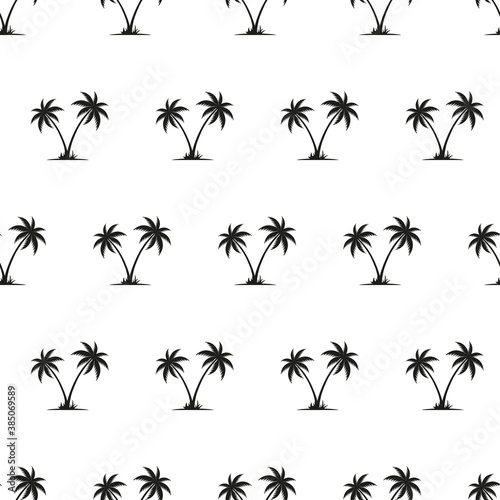 Seamless pattern with silhouettes of palm trees isolated on white background