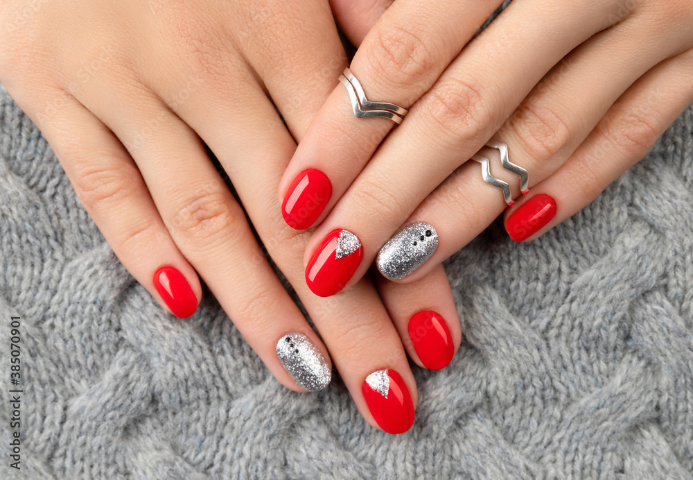 Woman's hands with fashionable red manicure.