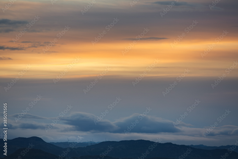 Windmills under sunrise