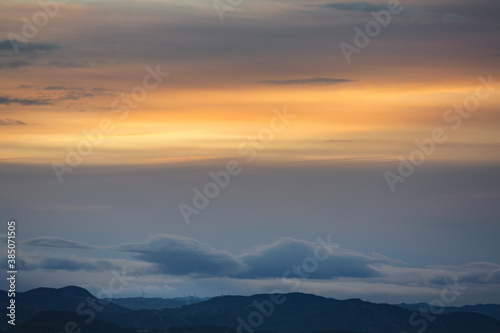 Windmills under sunrise