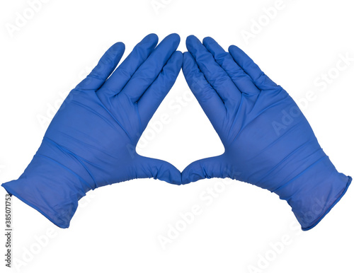 Hands wearing blue nitrile examination gloves making a diamond or kite frame between thumb and index finger with fingers closed, palms down.  Female hand isolated, no skin