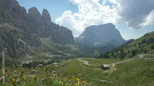 Static Backdrop of Beautiful green nature valley in the Dolomites in Europe on a sunny summer day, Italy photo
